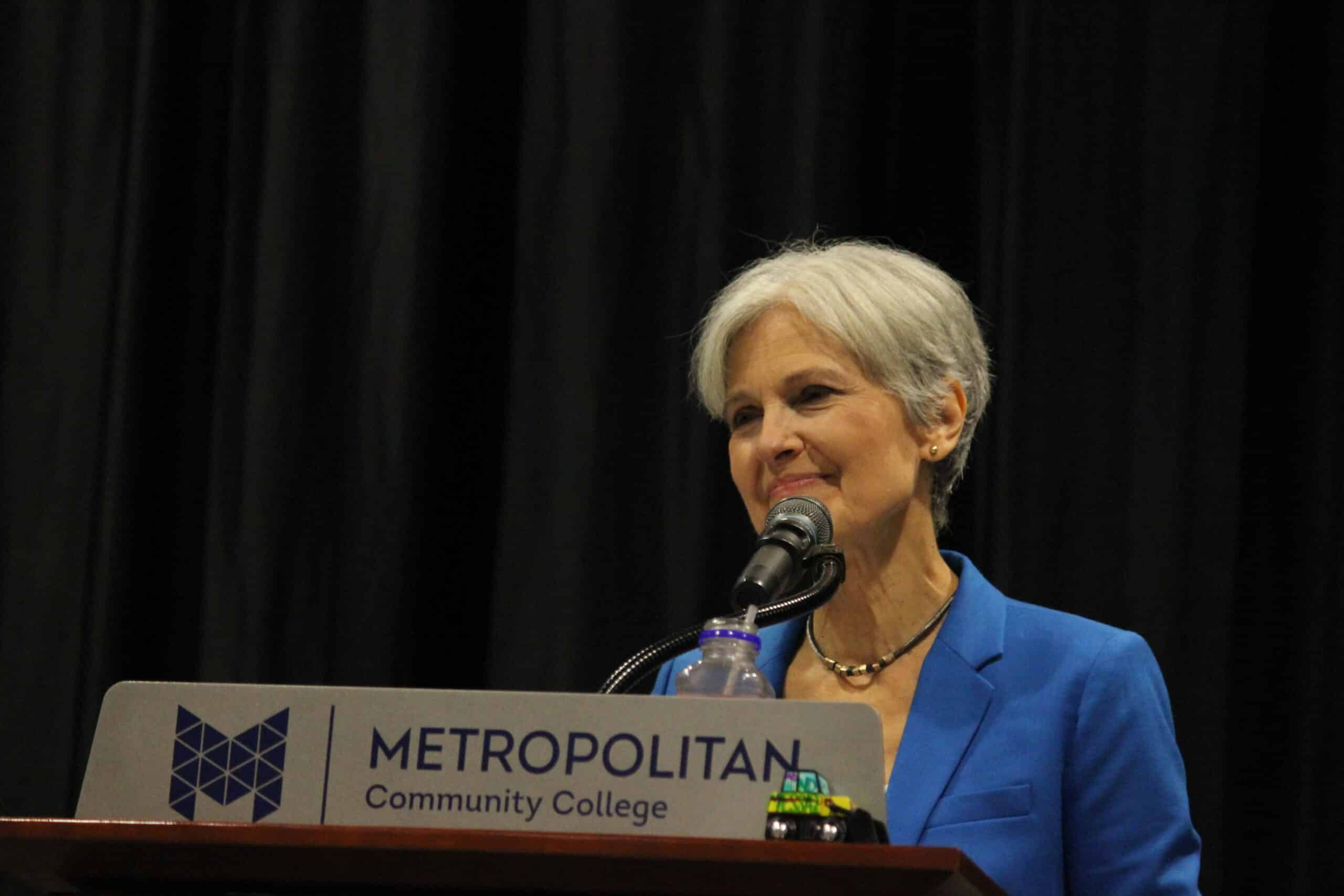 May contain one person speaking at a podium labeled Metropolitan Community College.