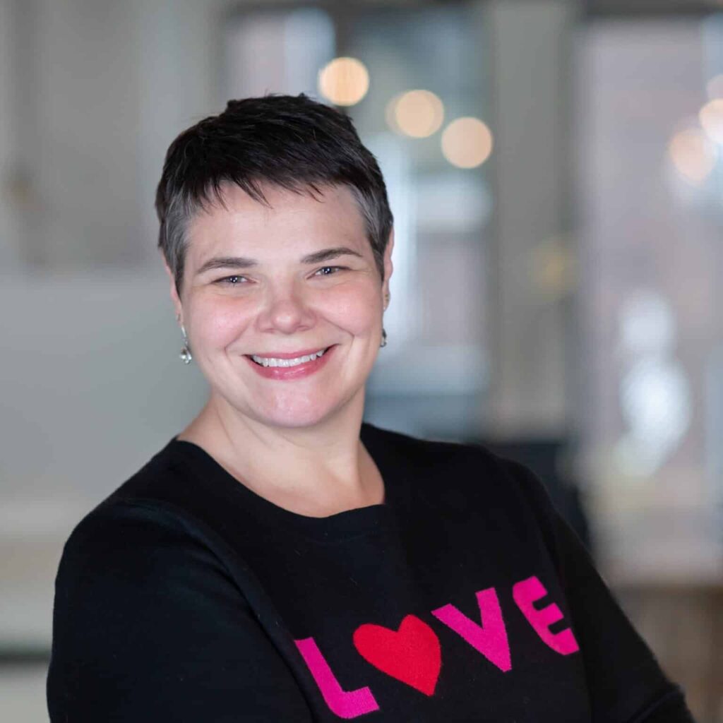 One person wearing a black shirt with "LOVE" in pink and red.